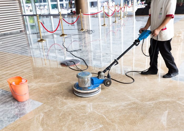 people polishes floor indoors